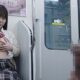 電車で向かいに座る乗客に巨乳を見せつける変態JK
